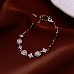 Elegant 18K gold-plated adjustable square bracelet with sparkling zircon flower links