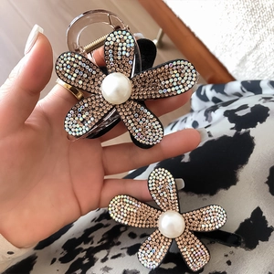 French style sunflower hair claw with sparkling rhinestones and center pearl accents