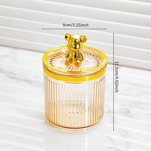 Detailed view of striped storage jar with golden bear lid and 12.5cm height dimensions