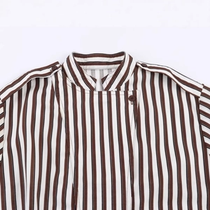 Vertical striped long sleeve shirt with stand collar and shoulder epaulettes on white backdrop