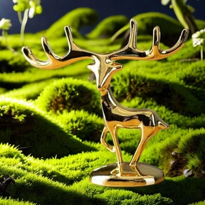 Detailed close-up of a golden deer ornament with branched antlers for jewelry display
