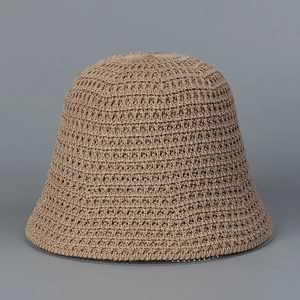 Detailed macro view of the breathable hollow knit pattern on this khaki bucket hat