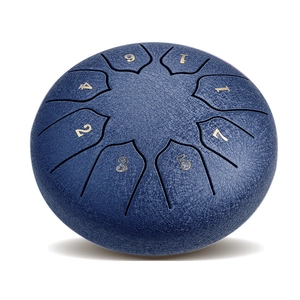 Close-up of blue steel tongue drum with embossed numeric notes and leather-like texture