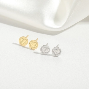 Minimalist round stud earrings with heart lattice pattern in gold and silver finish