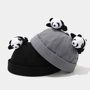 Black and grey brimless docker hats featuring cute plush panda decorations on canvas