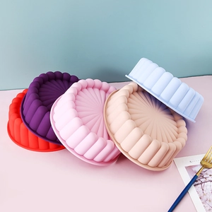 Colorful set of sunflower silicone cake molds in various pastel tones on a creative background
