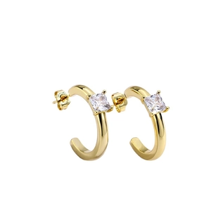 Golden C-shaped hoop earrings featuring square zircon stones in a minimalist style