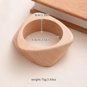 Close-up of geometric natural wood bangle with detailed size and weight parameters