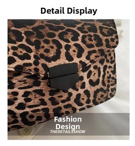 Detailed view of leopard print crossbody bag with black matte geometric metal buckle