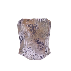 Detail of slim-fit leopard and tiger print strapless corset top with brown animal patterns