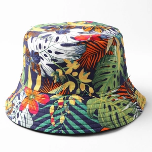 Detailed close-up of vibrant tropical leaf and floral print on high-quality cotton fabric