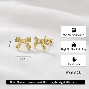 Handmade 925 sterling silver golden ribbon bow stud earrings with polished wavy texture