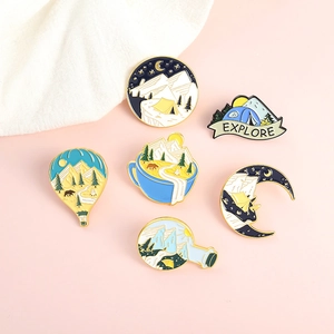 Set of 6 outdoor adventure enamel pins featuring snowy mountains and tents on pink backdrop