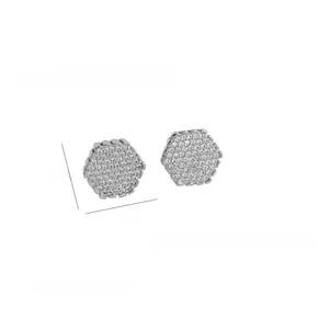 Macro shot of silver hexagonal stud earrings with sparkling pavé zircon inlay details