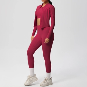 Detailed view of women's dark red three-piece yoga set with slim fit jacket and leggings