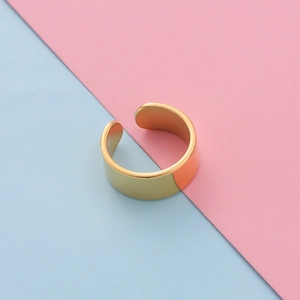 Detailed view of wide open gold ring showing mirror-polished finish and smooth surface