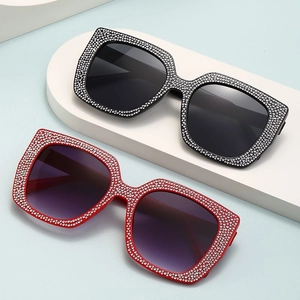 Luxury oversized rhinestone sunglasses for women in black and red frames with UV protection