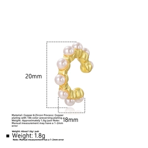 Detailed view of C-shaped gold-plated copper ear cuff with white pearls and zircons