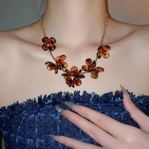 Vintage leopard acrylic flower necklace with amber resin petals and gold chain for women