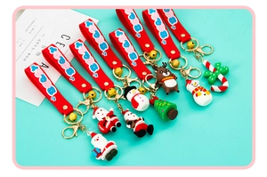 Detailed view of 3D Christmas silicone keychains with wristbands and small bells