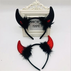 Glittery red and black devil horn headbands with feather trim for Halloween costumes