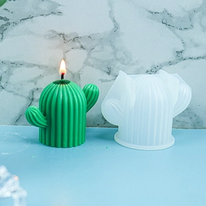 DIY cactus silicone mold with finished green candle featuring realistic flame details