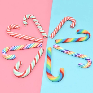 Macro shot of colorful striped DIY resin candy canes for Christmas craft decoration