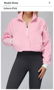 Detail of cherry blossom pink fleece jacket with white zipper and ribbed cuffs for women