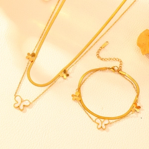 Detail of 18k gold plated double-layer stainless steel necklace and bracelet with butterflies