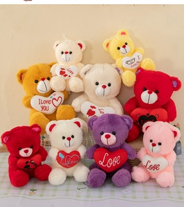 Detail showing a colorful collection of plush teddy bears holding embroidered love hearts