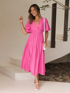 Detail of V-neck puff sleeves and layered cake hem on this rose red midi summer dress