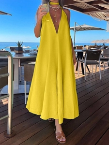 Deep V-neck halter maxi dress in vibrant yellow for beach vacation and summer style