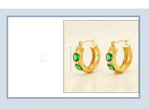 Close-up of 18K gold plated stainless steel C-hoop earrings with green zircon stones