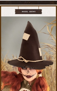 Detail of brown scarecrow witch hat with patchwork and hemp rope in a rustic field