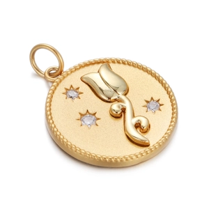 Detail of golden tulip pendant with embossed floral pattern and small inlaid diamonds