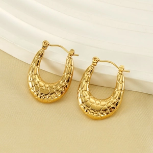 Gold U-shaped titanium steel earrings with embossed scale texture and 18K plating