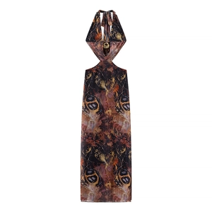 Sexy halter neck maxi dress with abstract print, waist cut-outs, and gold ring detail