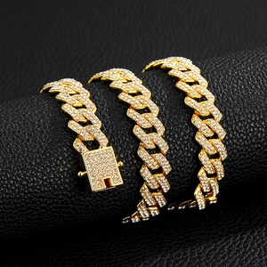 Chunky gold-tone Cuban link necklace with sparkling crystals and encrusted square clasp