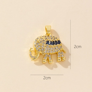 Detailed view of a gold elephant pendant with blue zircon stones and 2cm size measurement