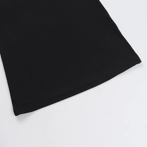 Close-up of the black slim fit dress hem showing smooth fabric texture and neat stitching