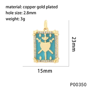 Detailed view of 18K gold plated heart pendant with blue enamel and crystal inlay