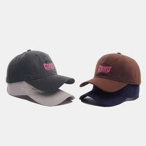 Close-up of assorted cotton baseball caps with 3D CUHU letter embroidery detail