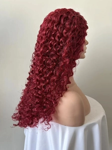 Side view of long wine red curly wig with tight afro coils on a mannequin head