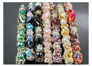 Detailed view of colorful crystal beaded hair clips in various vibrant shades
