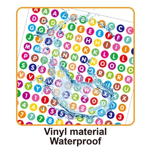Action shot of waterproof vinyl alphabet stickers showing water droplets on the surface