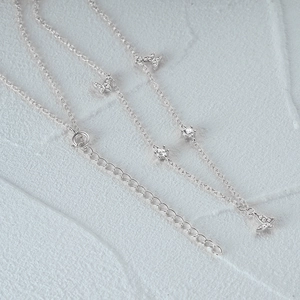 Detailed macro view of S925 silver butterfly necklace with zircon stones and adjustable chain