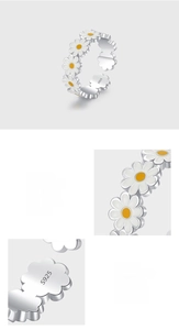 Detailed macro view showing the S925 sterling silver stamp and polished enamel daisy finish