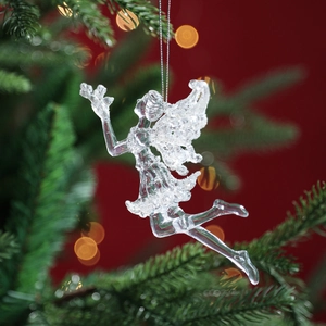 Transparent acrylic fairy angel ornament hanging on Christmas tree with bokeh lights