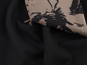 Macro shot of abstract pattern fabric and black mesh texture on sleeveless bodycon dress