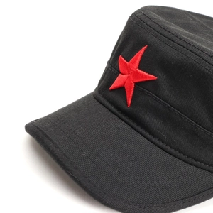 Detail of red embroidered star on black flat top military cap with premium stitching
